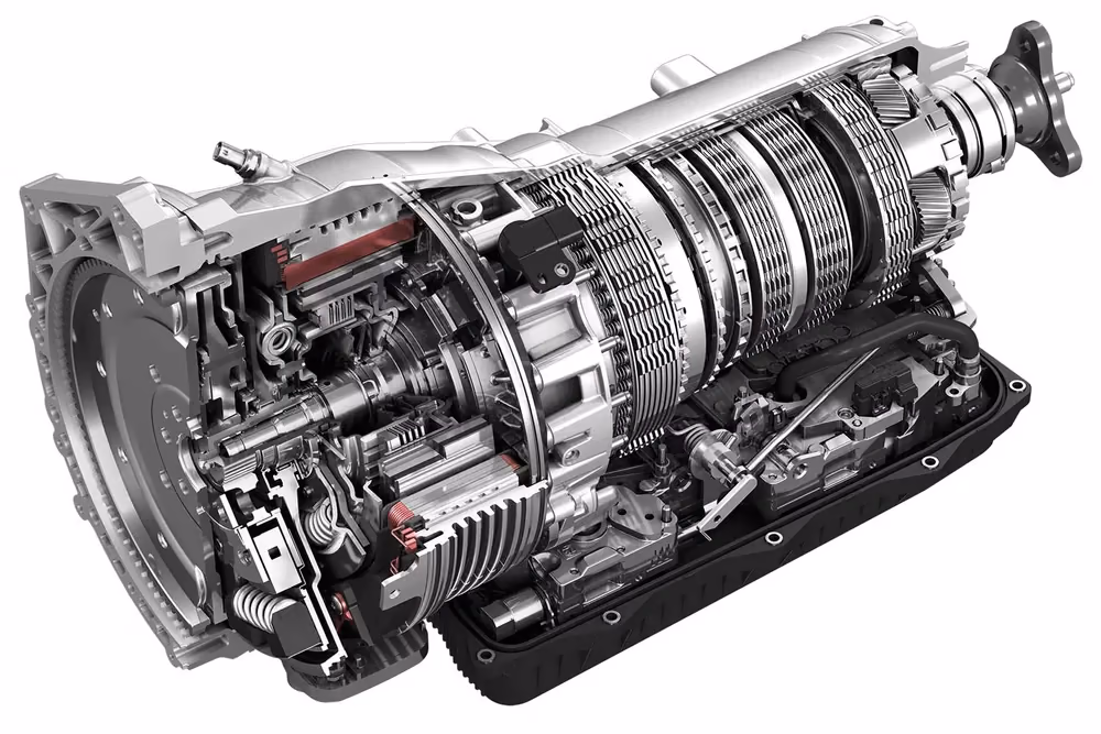 Angled automatic transmission cutaway showing internal clutch packs and hydraulic components